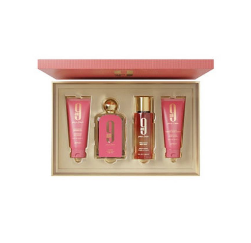 A 9-piece fragrance gift set by Giorgio Armani, featuring four pink and gold body care products arranged inside an open beige box with a pink lid, set against a plain white background.