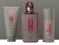 A three-piece men's grooming set by AFNAN, featuring a 9 pm Rebel shower gel tube, a matching shower gel bottle with a metallic cap, and a cylindrical body wash bottle, all in gray and red packaging against a gray striped background.