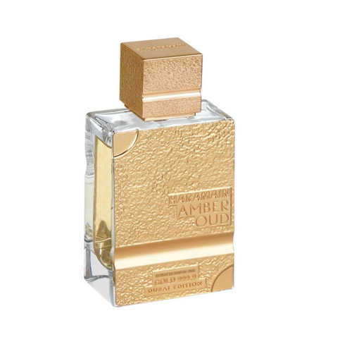Amber Oud perfume bottle with a textured gold cap and gold front panel, shown on a plain white background.