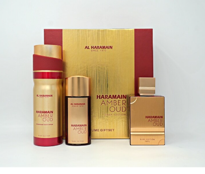Al Haramain Amber Oud perfume gift set featuring a large gold and red box, a tall cylindrical bottle with a red cap, a smaller dark bottle with a gold cap, and a rectangular perfume bottle with a gold cap, all on a white background.