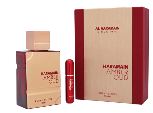Haramain Amber Oud Ruby Edition perfume set featuring a 200ml rectangular bottle, a matching 20ml travel spray atomizer, and its signature textured beige and red packaging box. Al Haramain Amber Oud Ruby Edition Unisex Eau de Parfum 200ml bottle with red travel spray atomizer and matching cream and red gift box - Authentic Perfume Store UPC 6291100131853