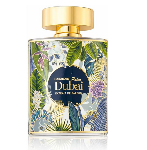 Haramain Palm Dubai Extrait de Parfum bottle with a gold cap and a tropical floral patterned label, shown on a white background with a reflection.