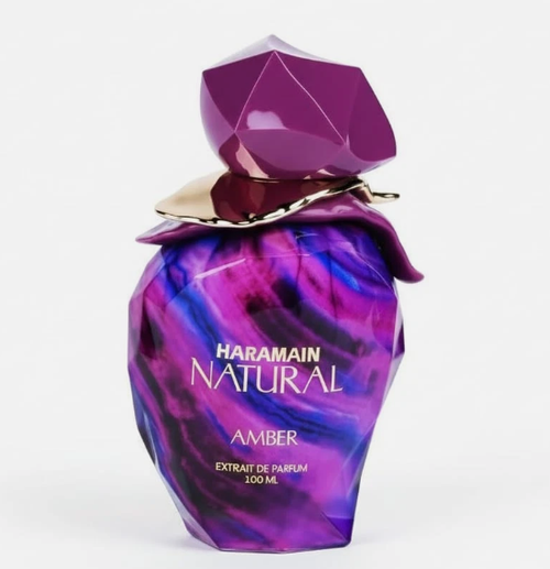 Haramain Natural Amber Extrait de Parfum 120ml bottle, featuring a faceted purple and blue marbled design with a metallic gold collar and a faceted purple cap, set against a plain white background.