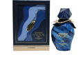 Al Haramain Natural Iris Extrait de Parfum shown with its outer packaging box. The perfume bottle is a deep blue with a faceted cap and gold lettering, while the box features an abstract blue and gold wave design.