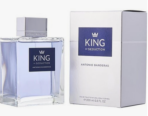 Antonio Banderas King of Seduction Eau de Toilette bottle and its packaging box, featuring a clear glass bottle with a light blue tint and a silver cap next to a white box with a blue label.