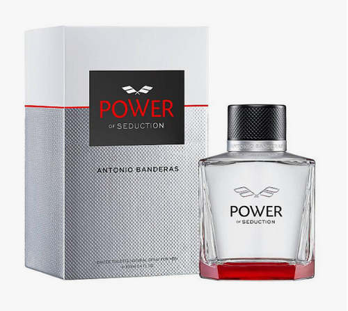 Antonio Banderas Power of Seduction fragrance shown with its silver and white packaging box and a clear glass bottle with a black cap and red base, on a light gray background.