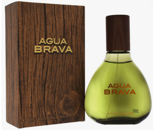 Agua Brava Eau de Toilette perfume bottle and its wooden-textured packaging box by Puig, featuring a greenish-yellow bottle and a dark brown wood-grain box with gold lettering.