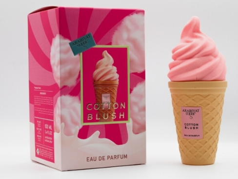 A pink soft-ice cream shaped perfume bottle stands next to its pink and white packaging box, both labeled 'Cotton Blush' by Arabian Soul, on a clean white background.