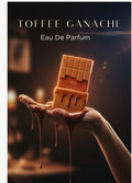 A perfume bottle shaped like a chocolate bar, labeled 'TOFFEE GANACHE Eau De Parfum,' held in a hand with dripping chocolate around it against a dark warm-toned background.