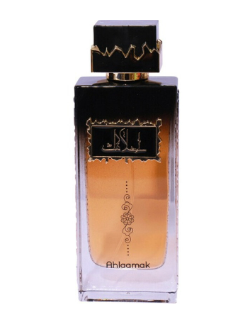 A rectangular glass perfume bottle with a black cap and a black-to-gold gradient label, containing amber-colored liquid. The brand name 'Ahlaamak' is printed near the bottom of the bottle.