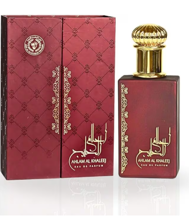 A bottle of Ahlam Al Khalee Eau De Parfum next to its matching red and gold box, featuring Arabic calligraphy and a gold cap.