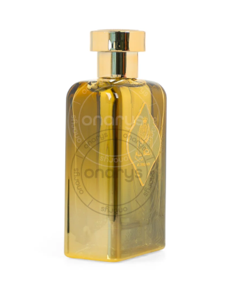 A rectangular glass perfume bottle filled with golden-yellow liquid, featuring a shiny gold cap and embossed branding on the front, set against a plain white background.