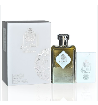 A bottle of Al Rabie Special Edition Eau de Parfum next to its white textured packaging box and a small white card, all featuring silver Arabic lettering and a crown emblem on a white background.