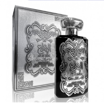 A black perfume bottle with ornate silver Arabic calligraphy and detailing, shown next to its matching silver decorative box on a white background.