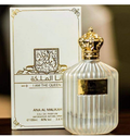 Ana Al Malikah Eau de Parfum bottle with a ribbed clear glass body and ornate gold cap, shown next to its white and gold packaging box.
