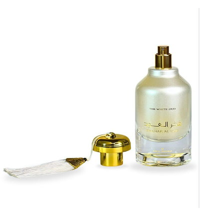 A bottle of Al Ghafsi 'The White Orchid' perfume with a gold atomizer cap and a decorative white tassel, shown on a plain white background.