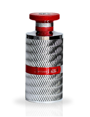 A cylindrical perfume bottle with a textured silver and black diagonal striped pattern, featuring a red cap and a red band with white text that reads 'JAZZED'.