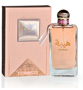 Heibah Eau de Parfum bottle with its matching pink packaging box, featuring Arabic calligraphy and a metallic cap on a white background.