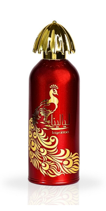 A red cylindrical perfume bottle with a metallic gold cap and gold peacock/flame-style graphics on the front, shown on a white background with a faint reflection below.