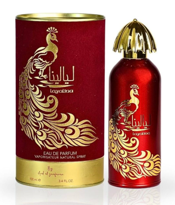 Layalina Eau de Parfum bottle and matching cylindrical box, both in metallic red with gold peacock illustrations and gold lettering, on a white background.