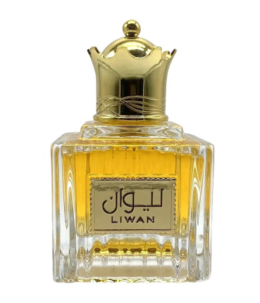 A bottle of Liwan perfume with a gold crown cap, featuring a clear glass body showing golden-yellow liquid inside and a gold label with Arabic script and 'LIWAN' in English.