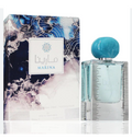 A perfume bottle and its retail box on a white background. The box has an abstract blue, white, and navy marbled design with the text 'MARINA' and Arabic lettering.