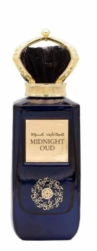 A dark blue glass perfume bottle with a gold and black ornate cap, featuring a gold label that reads 'MIDNIGHT OUD' in English.