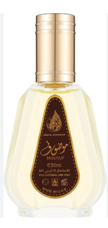 A 50ml bottle of Mousuf Ayurvedic essential oil with a gold cap and a gold and brown label, containing a pale yellow liquid, set against a plain white background.
