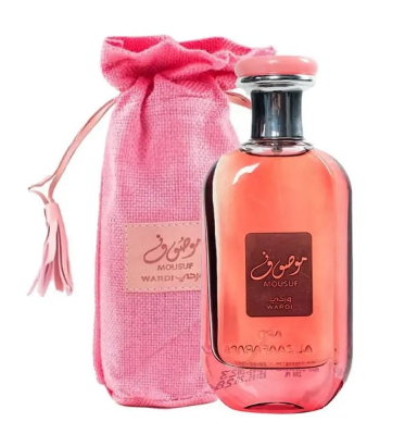 A pink perfume bottle with a silver cap next to a pink drawstring pouch with a beige label, on a white background.