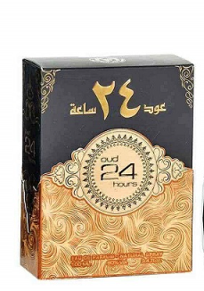 A rectangular product box with Arabic text, featuring a black upper section and an ornate gold lower section. The center displays a circular emblem with the text '24 Hours' and '24 ساع'.