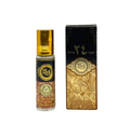 A perfume oil roll-on bottle with a gold cap stands next to its ornate black and gold box on a plain white background.