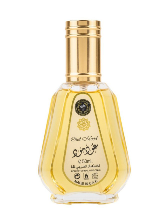 A 50ml bottle of Oud Miced perfume oil, featuring a clear glass bottle filled with golden-yellow liquid, a metallic gold cap, and a gold label with black text and Arabic calligraphy, set against a plain white background.