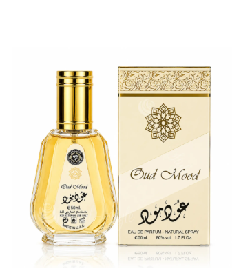 A bottle of Oud Mood Eau de Parfum with a gold cap and a beige-and-gold box beside it, shown on a clean white background.