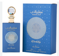 A blue perfume bottle with a gold cap stands beside its matching blue box. The bottle and packaging feature white Arabic script, the English name 'SAFFER AL FADH', a circular geometric floral design, and the word 'Everlasting'.