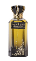 A bottle of Saafar al-Oud perfume with a black and gold crown cap, featuring amber-colored liquid inside a clear glass bottle with ornate gold detailing and a black label.