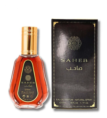 A bottle of Saheb Eau de Parfum with amber liquid and a gold cap, shown next to its black packaging box with gold lettering.