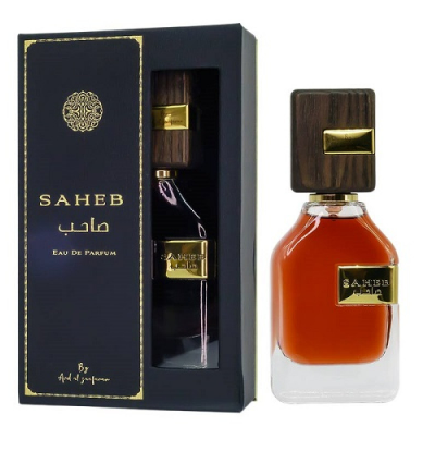 SAHAB Eau de Parfum bottle with amber liquid and dark wood cap next to its black presentation box with gold detailing.