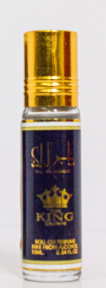 A small cylindrical roll-on bottle of King of Arabia cologne with a shiny gold cap and a dark navy blue label featuring a gold crown logo.
