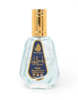 A 50ml bottle of Taj Al-Malika Eau de Parfum by Rasasi, featuring a clear glass bottle with a light blue liquid, a gold cap, and a navy blue and gold label.
