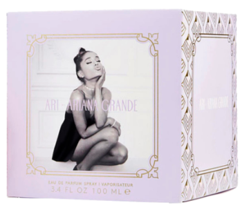 A lavender and white box for Ariana Grande's 'Sacrifice' Eau de Parfum, featuring a black-and-white photo of the artist on the front and gold decorative borders.