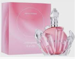 A pink perfume bottle with a faceted crystal-like design stands in front of a matching pink box. The bottle has a silver cap and the brand name 'Chanel' is partially visible on the bottle.