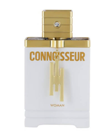 A bottle of Liwan perfume with a gold crown cap, featuring a clear glass body showing golden-yellow liquid inside and a gold label with Arabic script and 'LIWAN' in English.