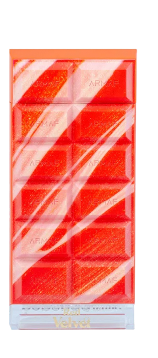 A square-shaped chocolate bar wrapped in clear cellophane packaging with a bright orange and white diagonal striped design and a white base.