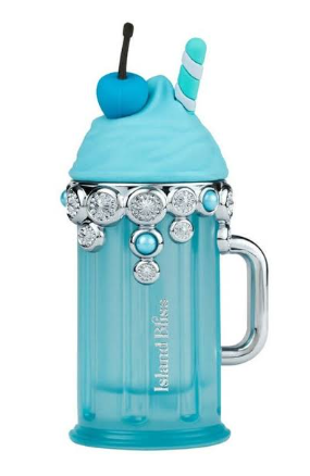 A light blue frosted glass mug with a handle, decorated with a silver rhinestone band and a whipped-cream lid topped with a blue cherry and striped straw, on a white background.