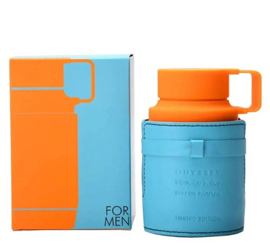 Odyssey For Men Eau de Parfum bottle in a light blue leather-like sleeve with an orange cap, shown next to its matching orange and light blue box on a white background.