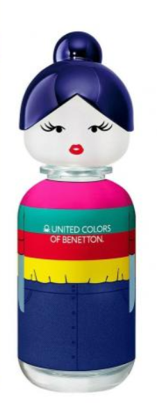 United Colors of Benetton perfume bottle designed like a doll with a dark blue hair bun, white face, and a colorful striped body in pink, teal, red, yellow, and blue.