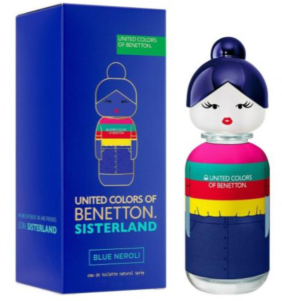 United Colors of Benetton Sisterland Blue Neroli perfume bottle and its blue packaging box, featuring a doll-like bottle design with a dark blue bun, white face, and colorful striped shirt.