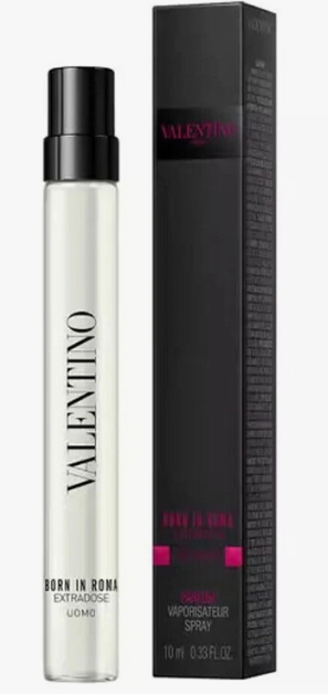 Valentino Born in Roma Extradose Uomo perfume spray bottle next to its black packaging box with pink accents.