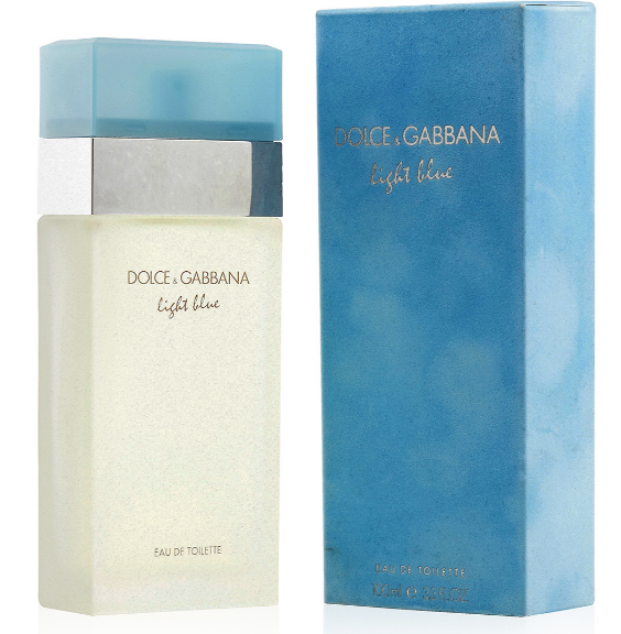 Dolce & Gabbana Light Blue Eau de Toilette bottle next to its blue packaging box, featuring a light blue cap, a silver band, and a frosted off-white bottle.