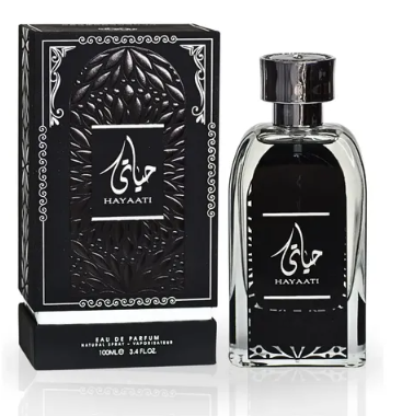 Hayaati Eau de Parfum bottle and its black ornate packaging box, featuring Arabic calligraphy and the brand name HAYAATI.